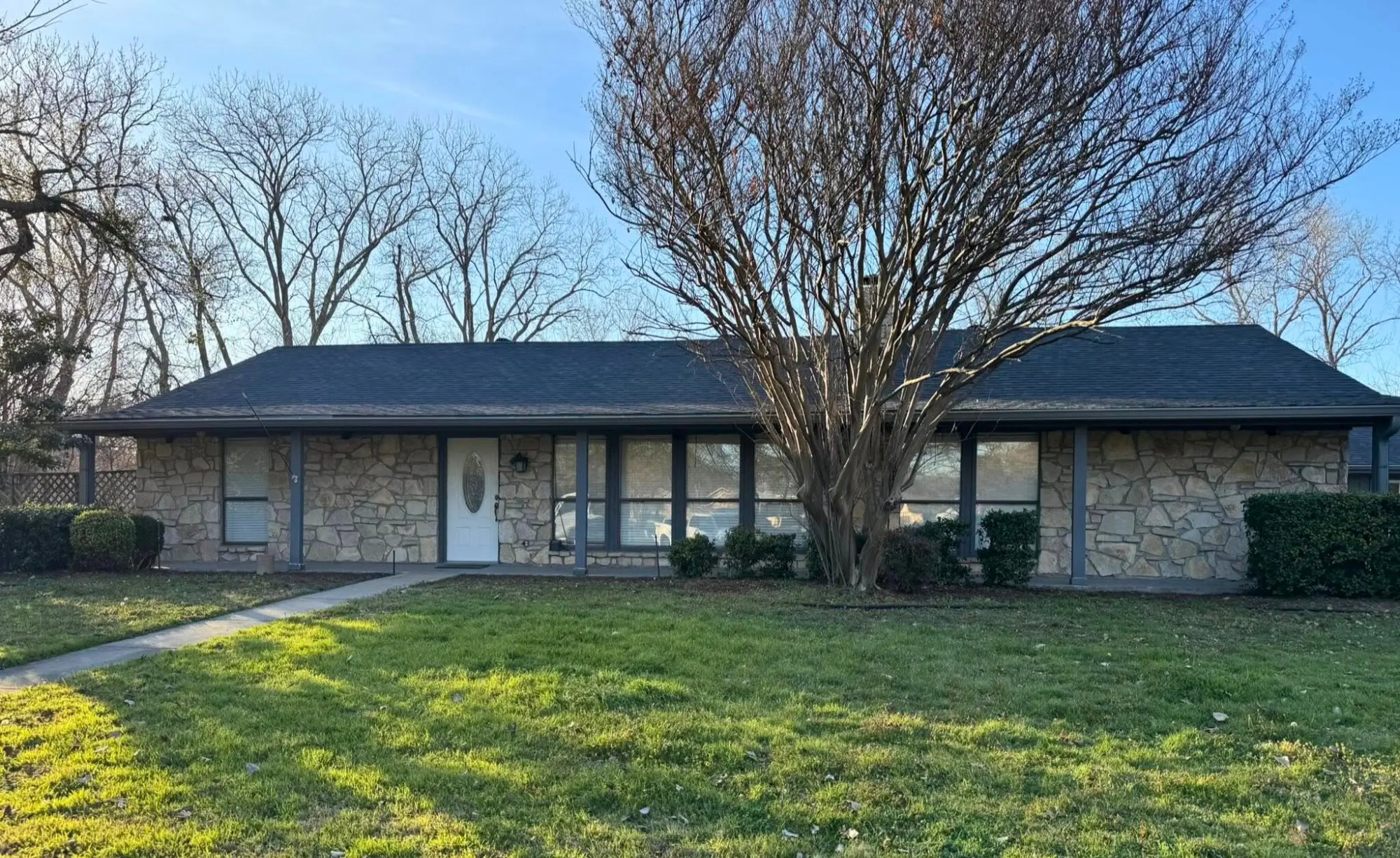Wind lifted shingles on residential roof in Fort Worth